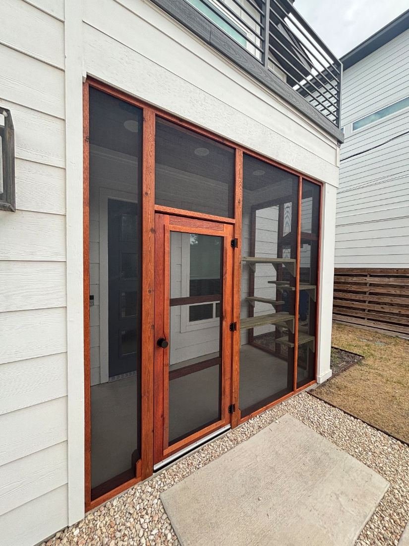 Screened entry porch on a modern Austin home, cedar frame and hand-built door room on an Austin deck