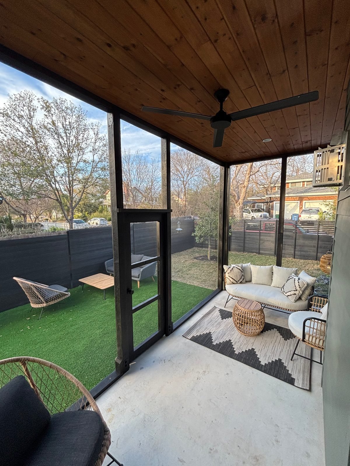 Porch catio conversion: covered Austin porch screened in cedar with climbing shelves