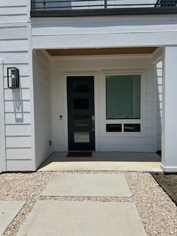 A narrow side entry before the catio was built